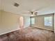 Spacious bedroom with ceiling fan, closet, and windows providing natural light at 2612 E 26Th Ave, Tampa, FL 33605
