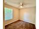 Bedroom featuring neutral walls, carpet, ceiling fan, and a window with horizontal blinds at 2612 E 26Th Ave, Tampa, FL 33605