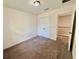 Bedroom with neutral walls, carpet and a closet with double doors at 2612 E 26Th Ave, Tampa, FL 33605