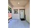 Home entryway featuring a light blue door, neutral stucco, and a 'Welcome' sign at 2612 E 26Th Ave, Tampa, FL 33605
