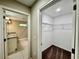 Hallway with access to bathroom with granite countertops and a walk-in closet at 2612 E 26Th Ave, Tampa, FL 33605