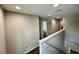 Well-lit hallway on the second floor with access to multiple rooms at 2612 E 26Th Ave, Tampa, FL 33605