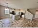 Kitchen featuring white cabinets, granite countertops, an island, and stainless steel appliances at 2612 E 26Th Ave, Tampa, FL 33605