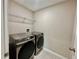 Laundry room with modern stainless steel Samsung washer and dryer at 2612 E 26Th Ave, Tampa, FL 33605