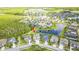 An aerial view of a home with a pond, lush trees, and beautiful neighborhood at 2812 Long Bow Way, Odessa, FL 33556