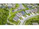 Gorgeous aerial view of neighborhood home with a screened pool, green lawn, and adjacent pond at 2812 Long Bow Way, Odessa, FL 33556