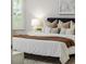 Bright, calming bedroom with plantation shutters, plush bedding, and stylish decor at 2812 Long Bow Way, Odessa, FL 33556