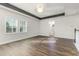 Open bonus room features natural light and modern luxury vinyl flooring at 2812 Long Bow Way, Odessa, FL 33556