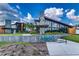 Beautiful exterior of a modern clubhouse with the 'Asturia' sign, enhanced by blue sky and landscaping at 2812 Long Bow Way, Odessa, FL 33556