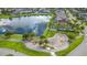 Scenic aerial of community park, pond, and surrounding homes, showcasing a serene environment at 2812 Long Bow Way, Odessa, FL 33556