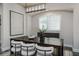 Elegant dining room with modern chandelier, unique wood table, and stylish chairs at 2812 Long Bow Way, Odessa, FL 33556
