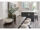 Bright, modern kitchen boasts white cabinets, a dark island, stainless appliances, and stylish countertops at 2812 Long Bow Way, Odessa, FL 33556