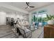 Open-concept living area flows seamlessly with the kitchen and offers views of the outdoor pool at 2812 Long Bow Way, Odessa, FL 33556