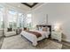 Bright main bedroom boasts large windows, high ceilings, and modern decor at 2812 Long Bow Way, Odessa, FL 33556