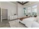 Well lit main bedroom has luxury vinyl floors, high ceilings, and neutral paint at 2812 Long Bow Way, Odessa, FL 33556
