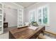 Stylish office featuring a large desk, bright windows, and modern decor at 2812 Long Bow Way, Odessa, FL 33556