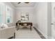 Bright office space with a modern desk, chair, and plantation shutters at 2812 Long Bow Way, Odessa, FL 33556
