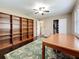 Bedroom features hardwood floors and a wall of shelves, perfect for storage at 3354 52Nd N St, St Petersburg, FL 33703