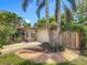 Charming single-story home with a well-manicured lawn, lush landscaping, and a one-car garage at 3354 52Nd N St, St Petersburg, FL 33703