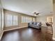 Cozy living room featuring wood floors, plantation shutters, and a comfortable gray sofa at 3354 52Nd N St, St Petersburg, FL 33703