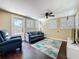 Comfortable living room with plantation shutters, hardwood floors, and backyard access at 3354 52Nd N St, St Petersburg, FL 33703