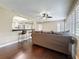 Living room looking into the kitchen with a breakfast bar and hardwood floors at 3354 52Nd N St, St Petersburg, FL 33703