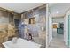 A tile lined shower and tub combination creates a stunning bathroom focal point at 3519 Richboro Dr, Holiday, FL 34691