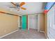 This carpeted bedroom has a large window and a spacious closet with double doors at 3519 Richboro Dr, Holiday, FL 34691