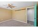 Bedroom features a ceiling fan, and a closet with double doors, and unique shelving at 3519 Richboro Dr, Holiday, FL 34691