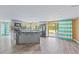 The updated kitchen with a stylish island and stainless appliances provides a functional workspace and focal point at 3519 Richboro Dr, Holiday, FL 34691