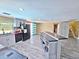 Well-lit kitchen boasts stainless appliances, an island with seating, and a view into other living spaces at 3519 Richboro Dr, Holiday, FL 34691