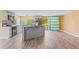 Spacious kitchen with an island, black appliances, and view into the backyard provides ample room to create and enjoy at 3519 Richboro Dr, Holiday, FL 34691