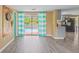 The living room with a view of the pool connects to a kitchen area with updated appliances, perfect for Florida living at 3519 Richboro Dr, Holiday, FL 34691