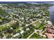 Expansive aerial view of a waterfront community featuring lush landscaping, private waterways, and surrounding natural beauty at 358 Highland Shores Dr, Ellenton, FL 34222