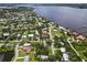 Aerial view of a home on the water showing the proximity to the river and other surrounding properties at 358 Highland Shores Dr, Ellenton, FL 34222