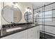 Updated bathroom with double vanity, black hardware, and tiled shower at 358 Highland Shores Dr, Ellenton, FL 34222