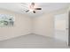 Bedroom featuring carpet floor, light cream walls, ceiling fan, one window, and a view to the next room at 358 Highland Shores Dr, Ellenton, FL 34222