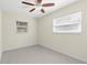 Bedroom with neutral walls, carpet, and window with blinds at 358 Highland Shores Dr, Ellenton, FL 34222