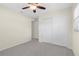 Bedroom featuring neutral walls, plush carpeting, ceiling fan, and closet for ample storage space at 358 Highland Shores Dr, Ellenton, FL 34222