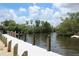 Scenic dock with calm water views, perfect for relaxing or water activities at 358 Highland Shores Dr, Ellenton, FL 34222