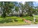 Charming single story home with a well manicured lawn and mature trees covered in spanish moss at 358 Highland Shores Dr, Ellenton, FL 34222