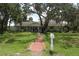 Charming single-story home with well-manicured lawn and mature trees at 358 Highland Shores Dr, Ellenton, FL 34222