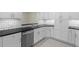 Bright white kitchen with black countertops, stainless steel appliances, and white subway tile backsplash at 358 Highland Shores Dr, Ellenton, FL 34222