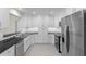 Updated kitchen with white cabinets, subway tile backsplash, and stainless steel appliances at 358 Highland Shores Dr, Ellenton, FL 34222