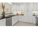 Modern kitchen featuring white cabinets, subway tile backsplash, and stainless steel appliances at 358 Highland Shores Dr, Ellenton, FL 34222