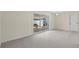 Living room featuring sliding glass doors to patio and entry door at 358 Highland Shores Dr, Ellenton, FL 34222