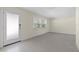 Living room with a light wall color, carpeting, a door to the outside, and a bright window at 358 Highland Shores Dr, Ellenton, FL 34222