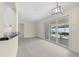 View of the living room with sliding glass doors leading to the patio at 358 Highland Shores Dr, Ellenton, FL 34222