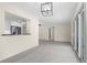 Open living room featuring sliding glass doors and a view to the kitchen at 358 Highland Shores Dr, Ellenton, FL 34222