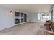 Covered patio with brick flooring, wooden benches and sliding door access to the backyard at 358 Highland Shores Dr, Ellenton, FL 34222